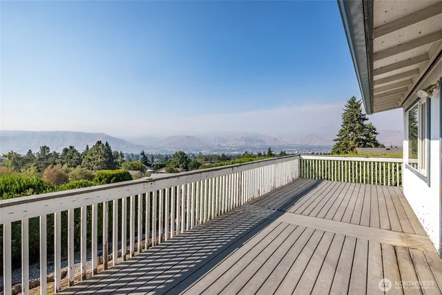 a view of balcony with wooden floor