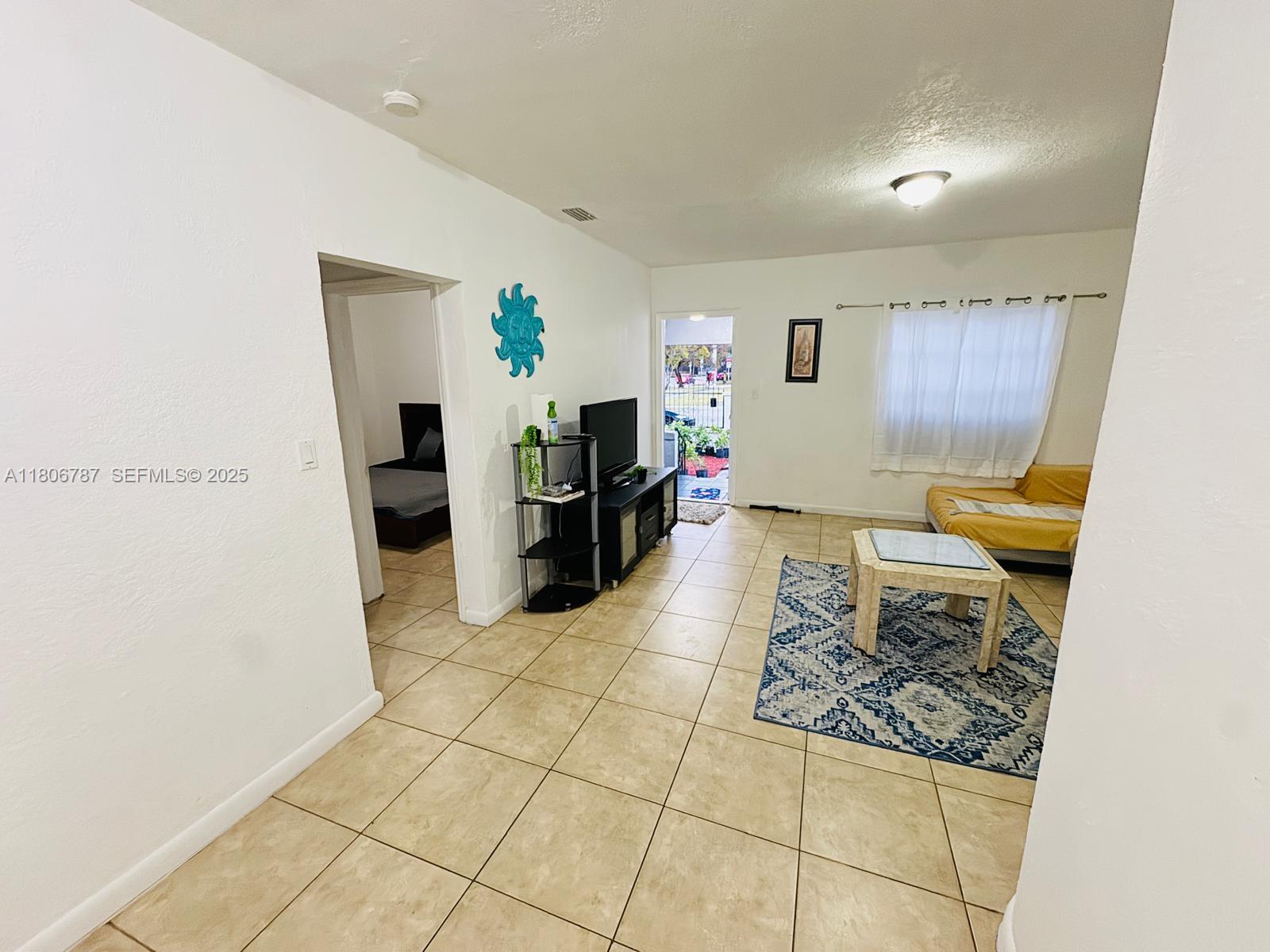 301 Northwest 37th Street Miami, FL 33127 - Photo 10 of 16 a living room with furniture