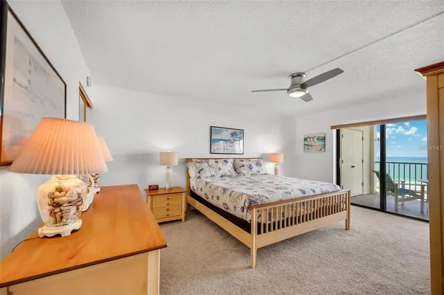 a bedroom with a bed and lamp with window