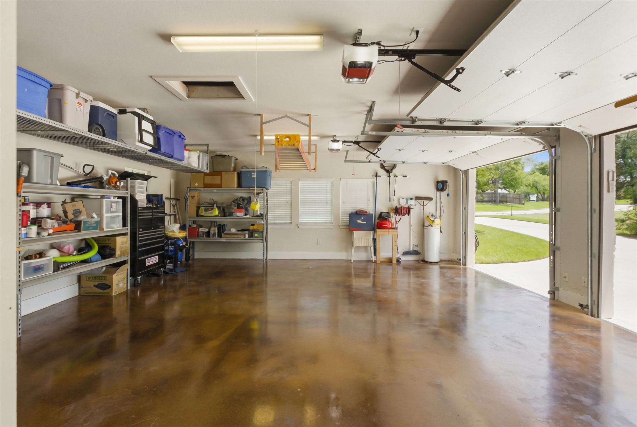 1804 Tanner Loop Taylor, TX 76574 - Photo 31 of 40 The poly-coated garage floor offers a low maintenance design.