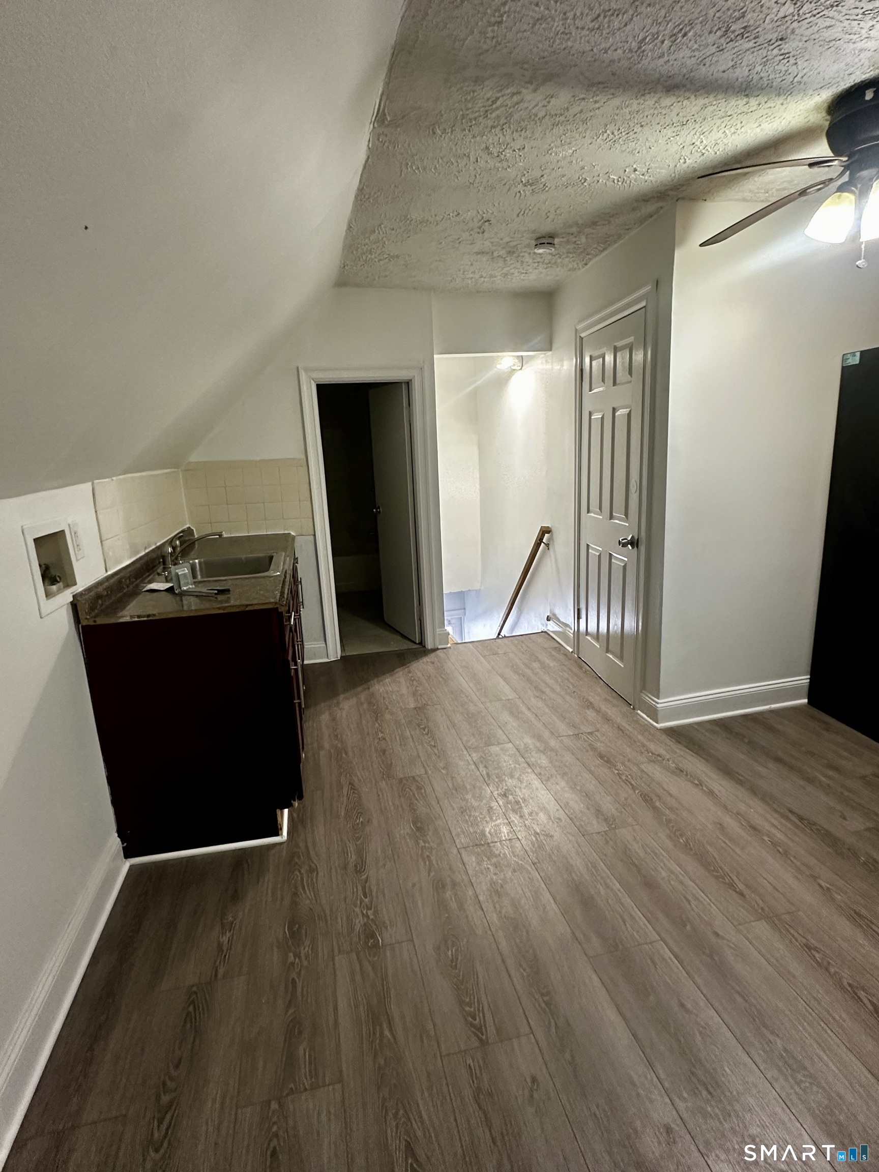 147 Helen Street, Unit 3 Bridgeport, CT 06608 - Photo 4 of 5 a bedroom with a bed and a dresser