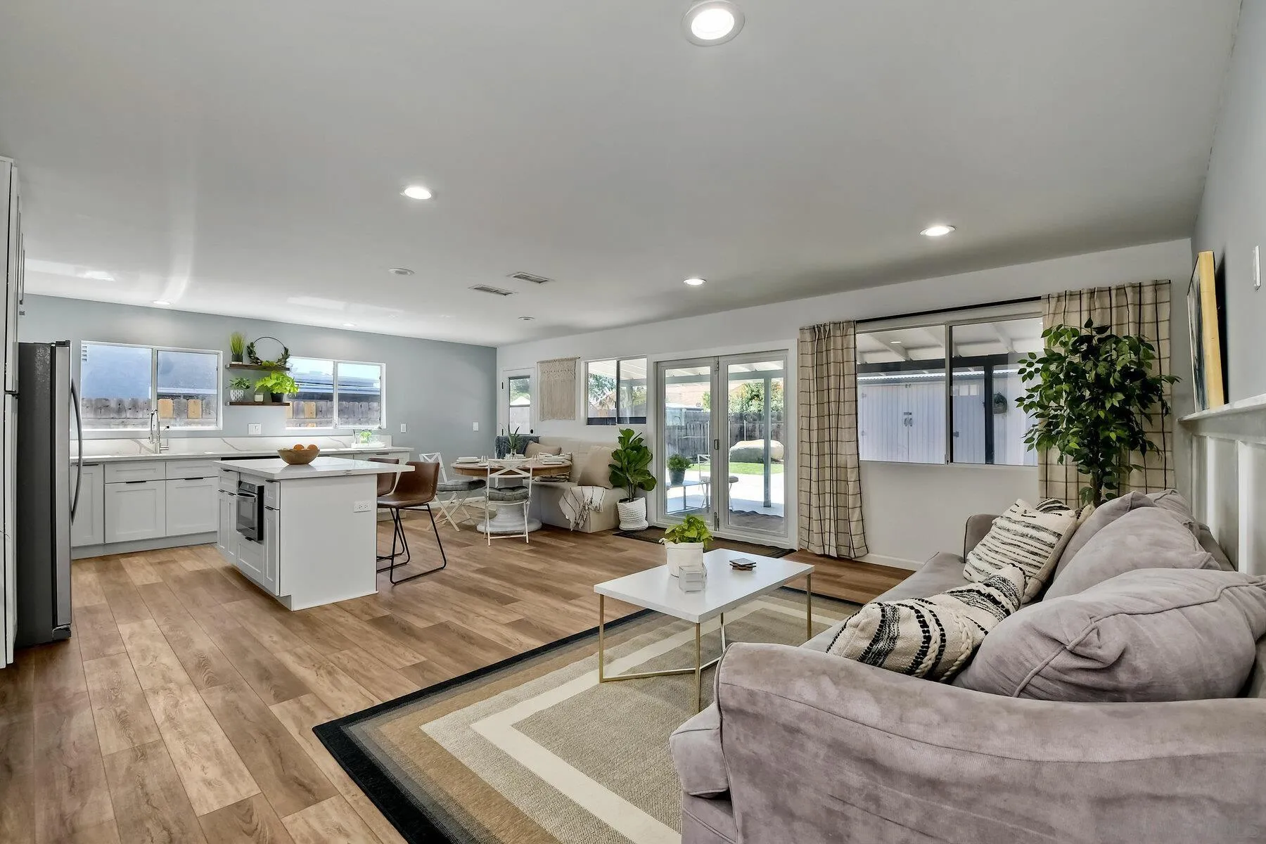 13360 Floral Avenue Poway, CA 92064 - Photo 14 of 37 a living room with furniture kitchen view and a large window