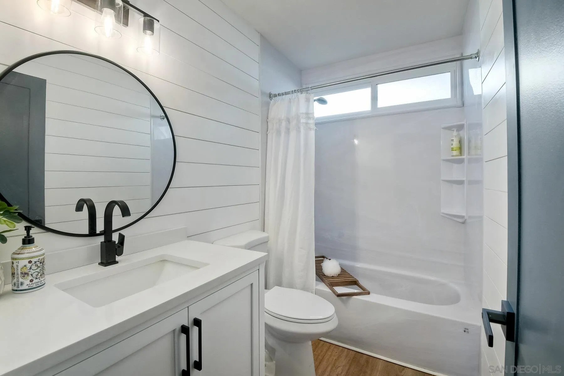 13360 Floral Avenue Poway, CA 92064 - Photo 17 of 37 a bathroom with a sink a toilet and shower