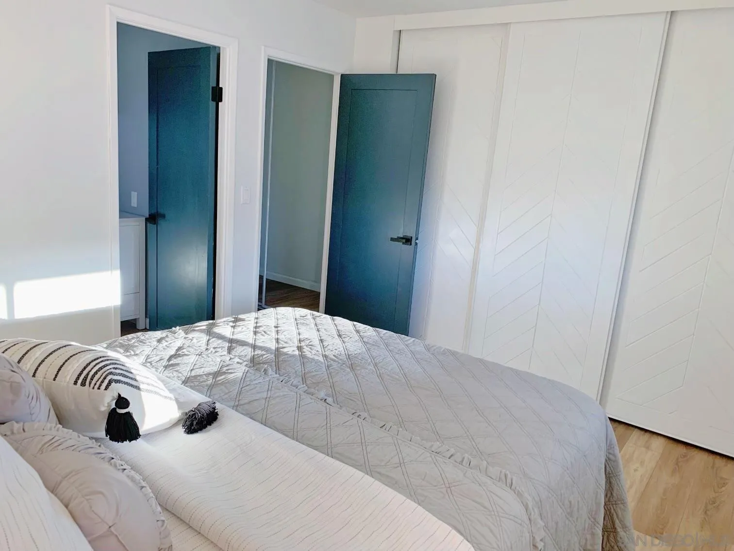 13360 Floral Avenue Poway, CA 92064 - Photo 19 of 37 a bedroom with a bed and a mirror