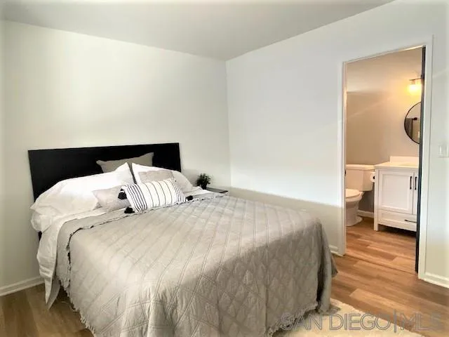 13360 Floral Avenue Poway, CA 92064 - Photo 21 of 37 a bedroom with a bed and a view of en suite