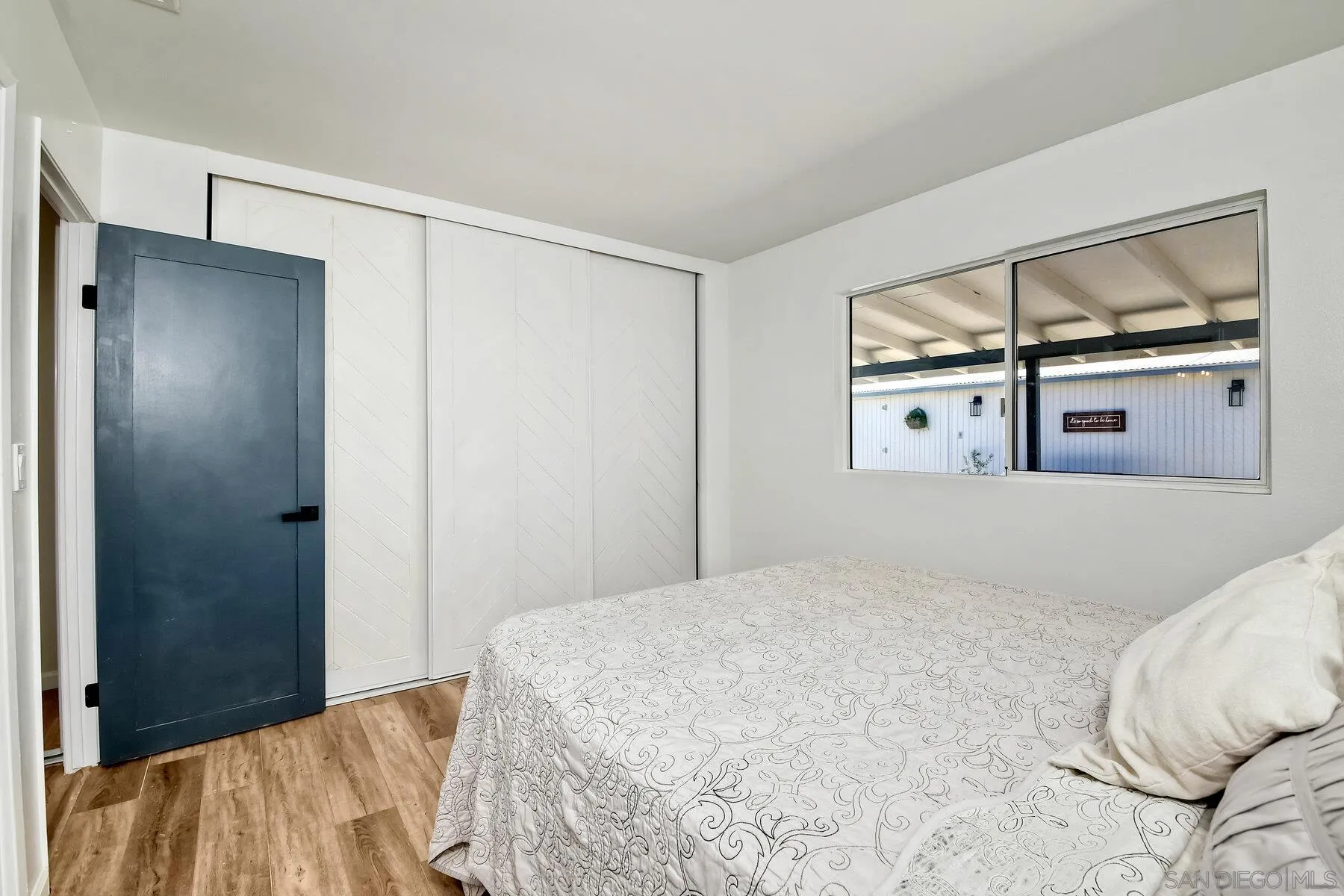 13360 Floral Avenue Poway, CA 92064 - Photo 22 of 37 a bedroom with a bed and a painting on the wall