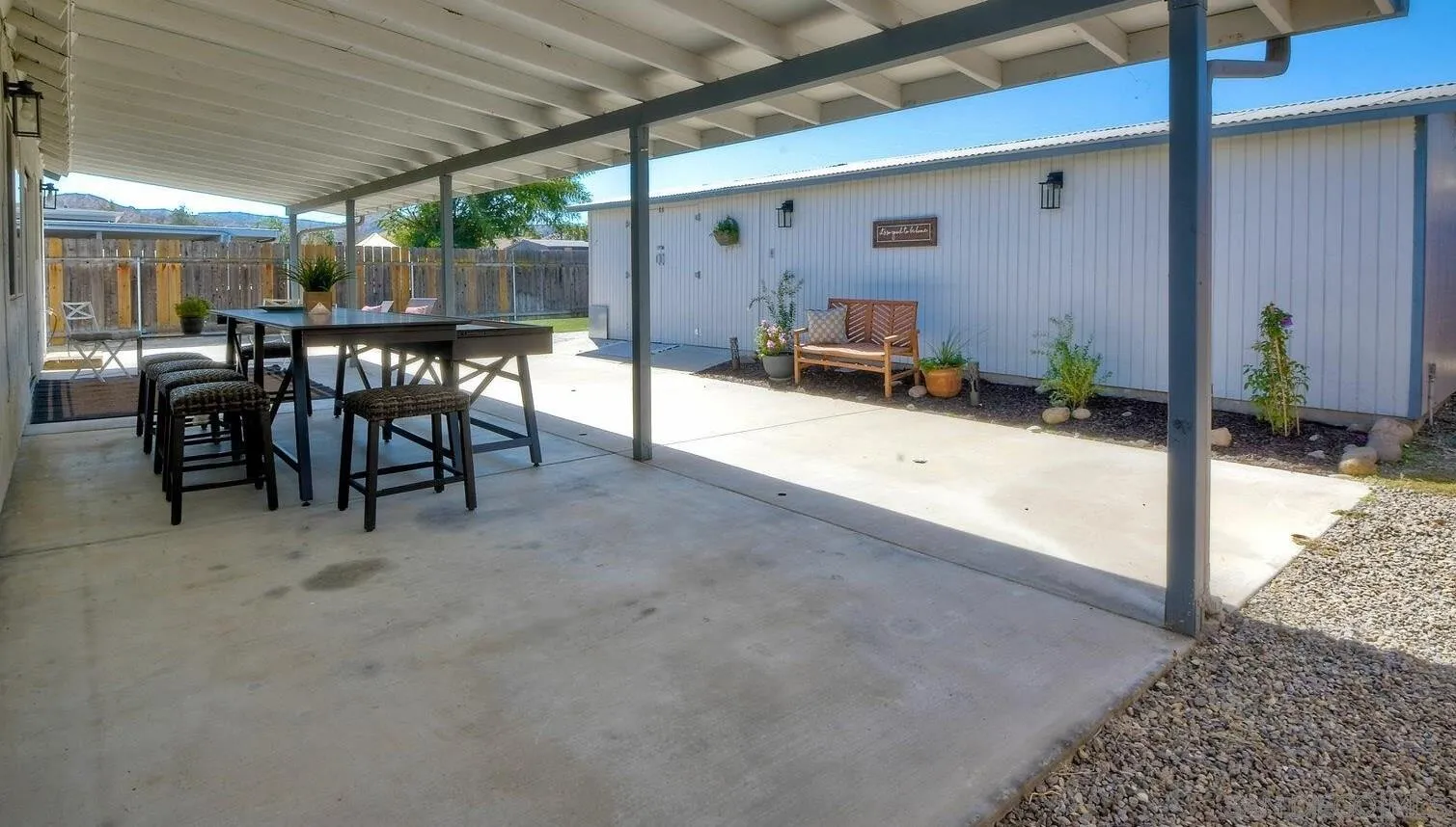 13360 Floral Avenue Poway, CA 92064 - Photo 25 of 37 a view of a patio with table and chairs a barbeque with wooden fence