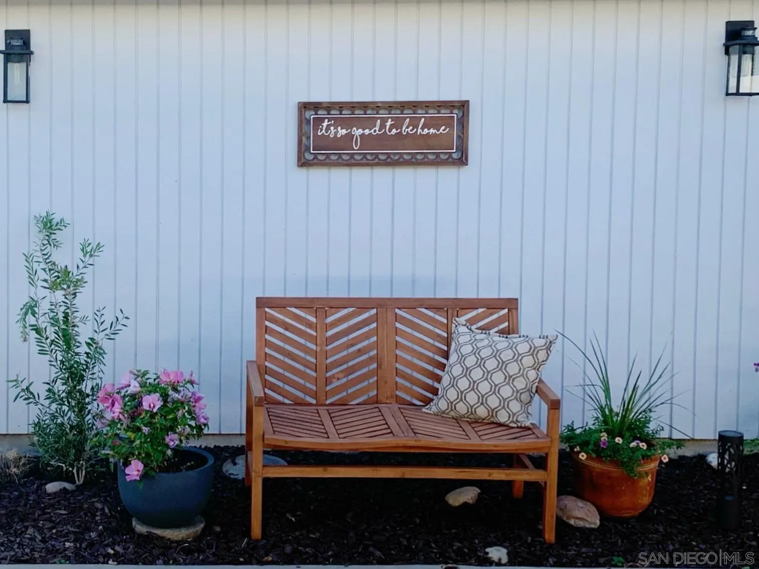 13360 Floral Avenue Poway, CA 92064 - Photo 26 of 37 a wooden bench sitting in backside of a house with potted plants