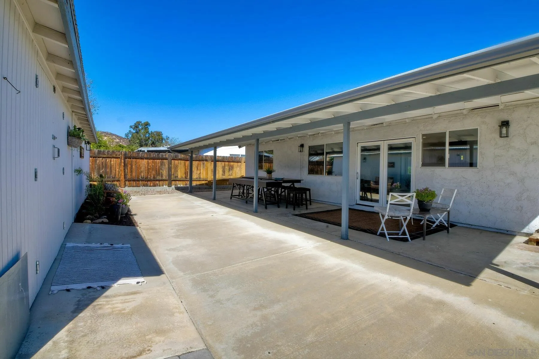 13360 Floral Avenue Poway, CA 92064 - Photo 29 of 37 a view of a patio with table and chairs a barbeque