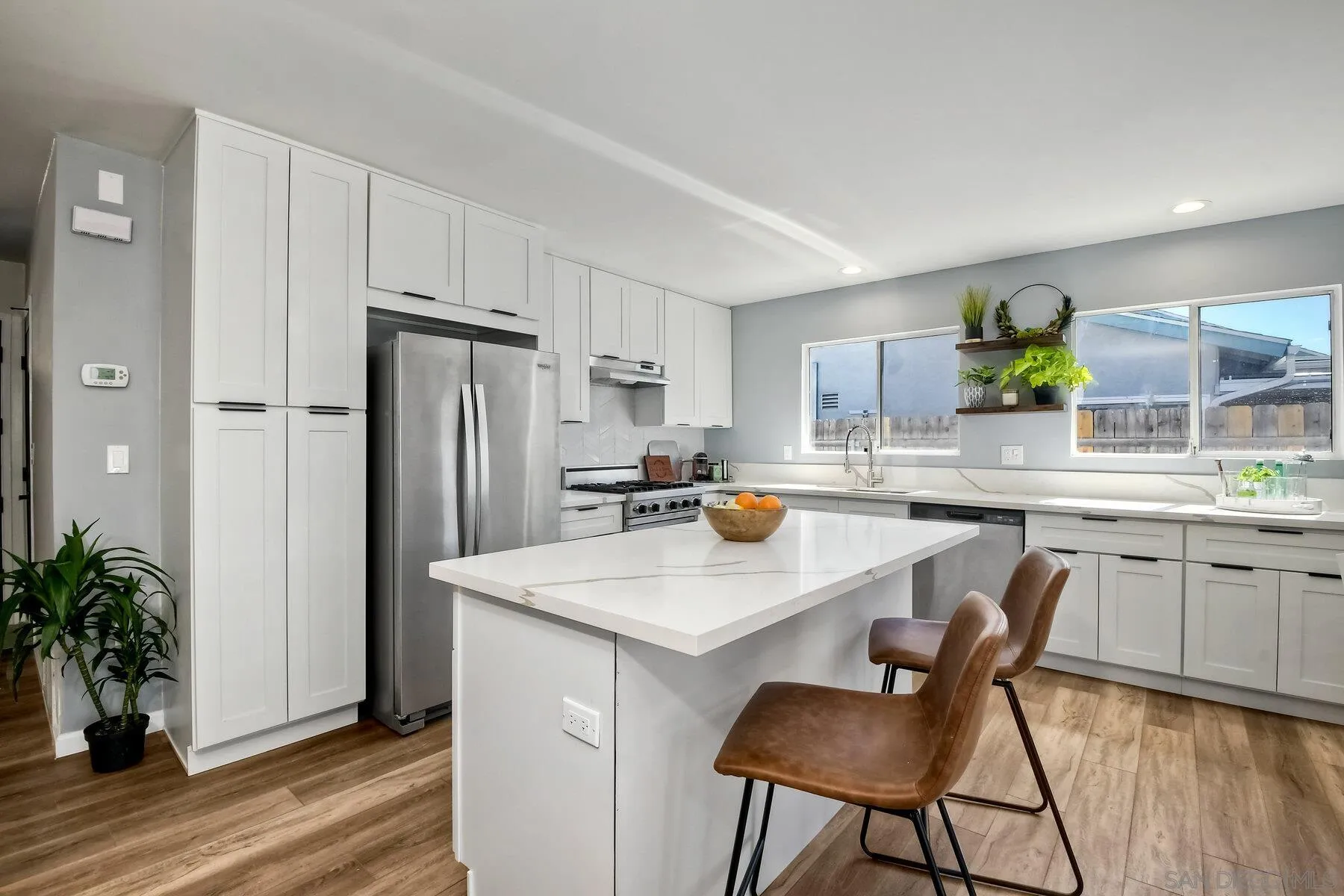 13360 Floral Avenue Poway, CA 92064 - Photo 6 of 37 a kitchen with refrigerator and cabinets