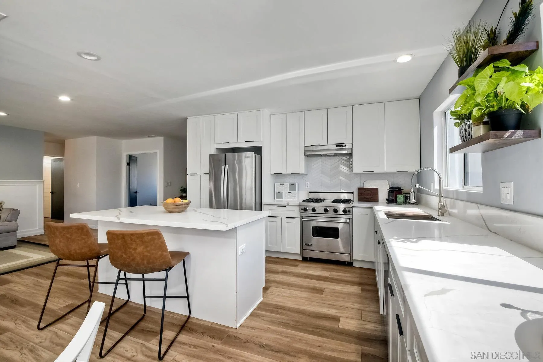 13360 Floral Avenue Poway, CA 92064 - Photo 7 of 37 a kitchen with a stove a sink and a refrigerator