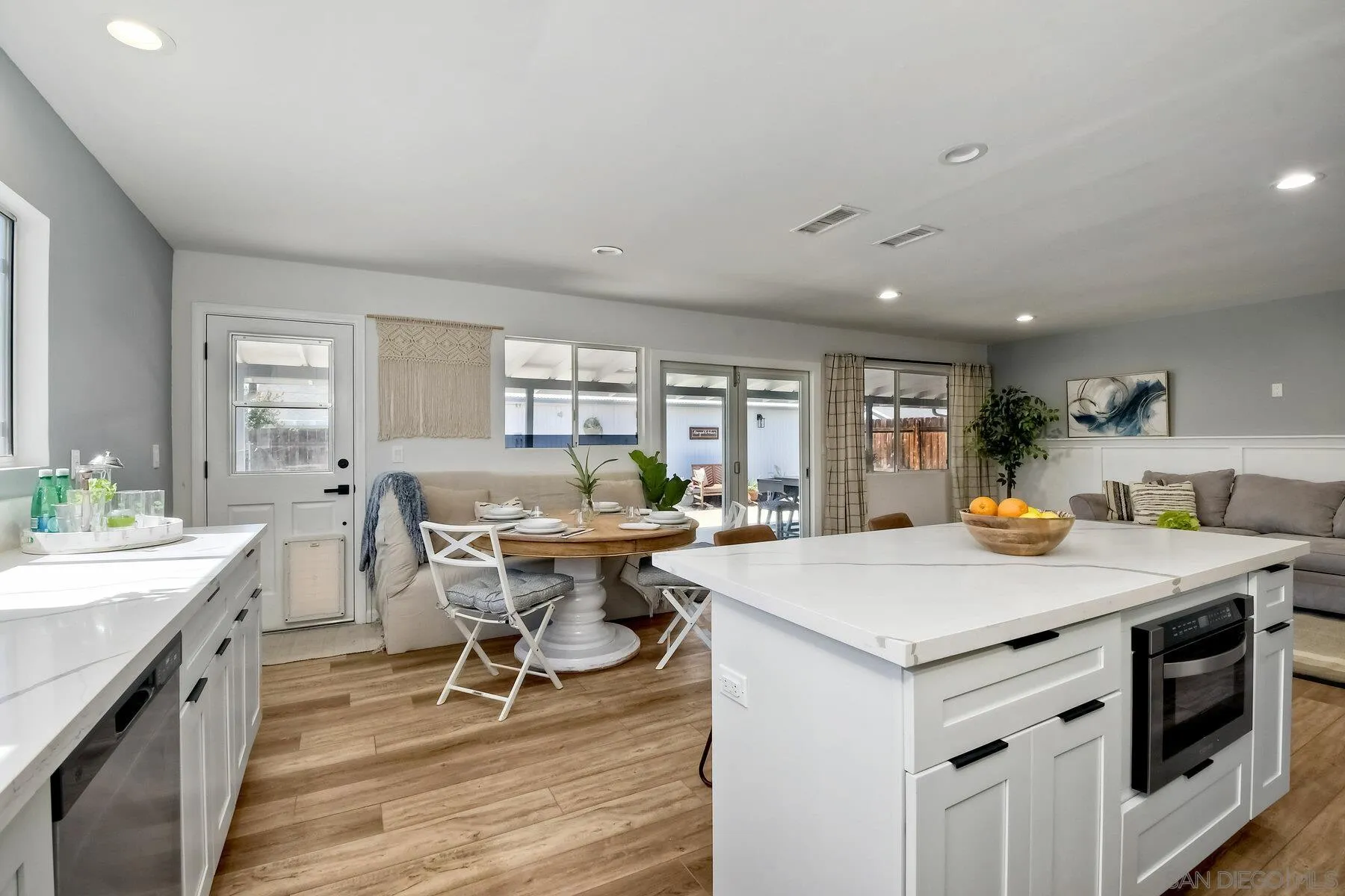 13360 Floral Avenue Poway, CA 92064 - Photo 8 of 37 a kitchen with a stove a table and chairs