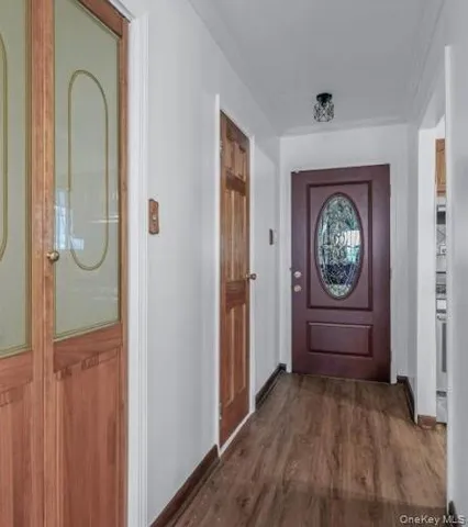 a view of entryway with wooden floor