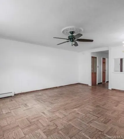 a view of a big room with carpet