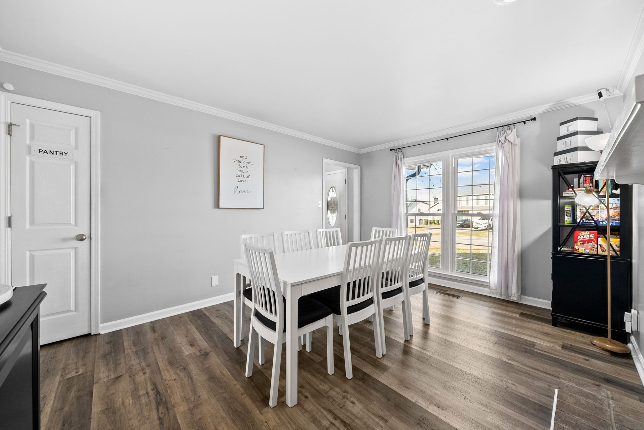 504 Eysian Road Clarksville, TN 37040 - Photo 16 of 41 a view of a dining room with furniture window and wooden floor