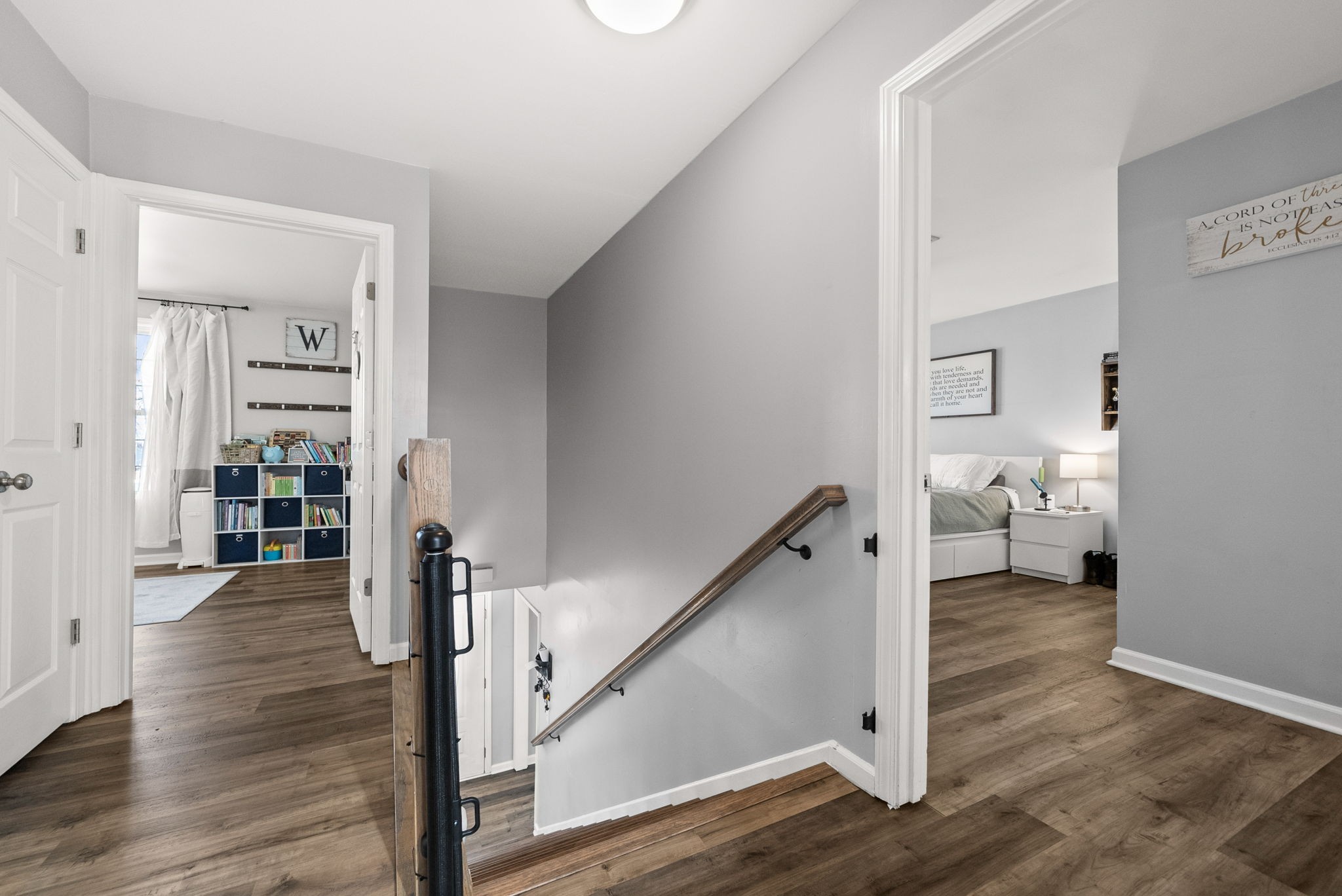 504 Eysian Road Clarksville, TN 37040 - Photo 20 of 41 a hallway with wooden floor table and stairs