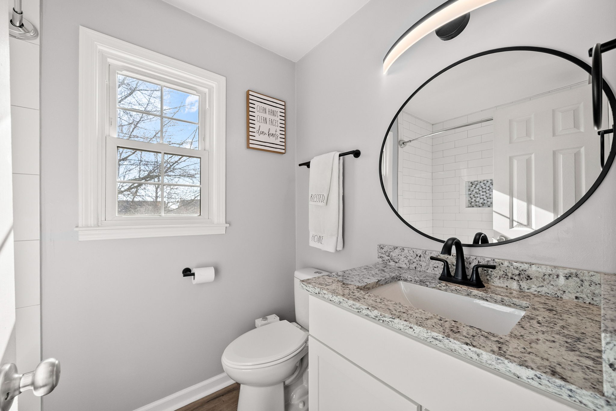 504 Eysian Road Clarksville, TN 37040 - Photo 27 of 41 a bathroom with a granite countertop sink a mirror and a toilet