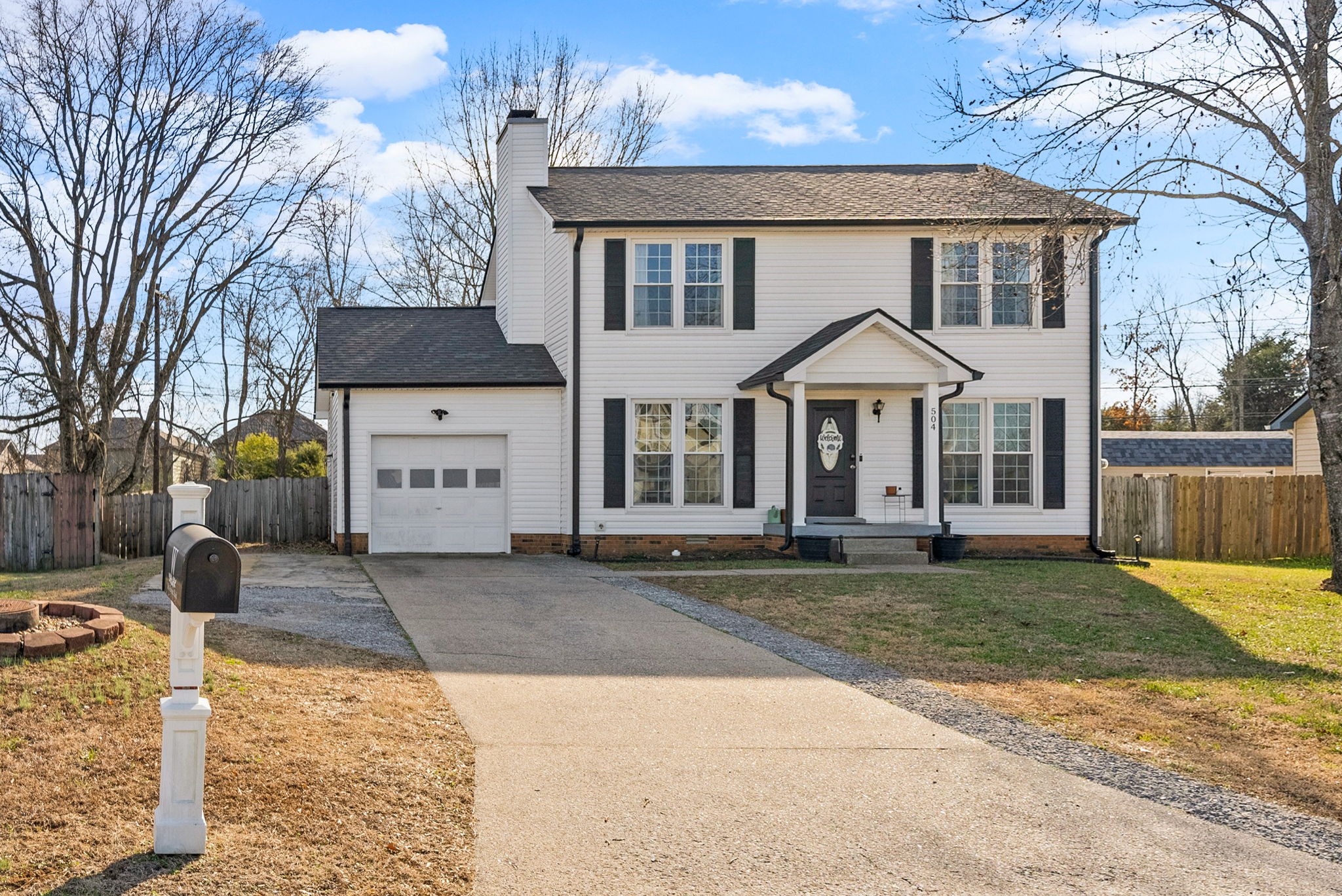 504 Eysian Road Clarksville, TN 37040 - Photo 3 of 41 a front view of a house with a yard and garage
