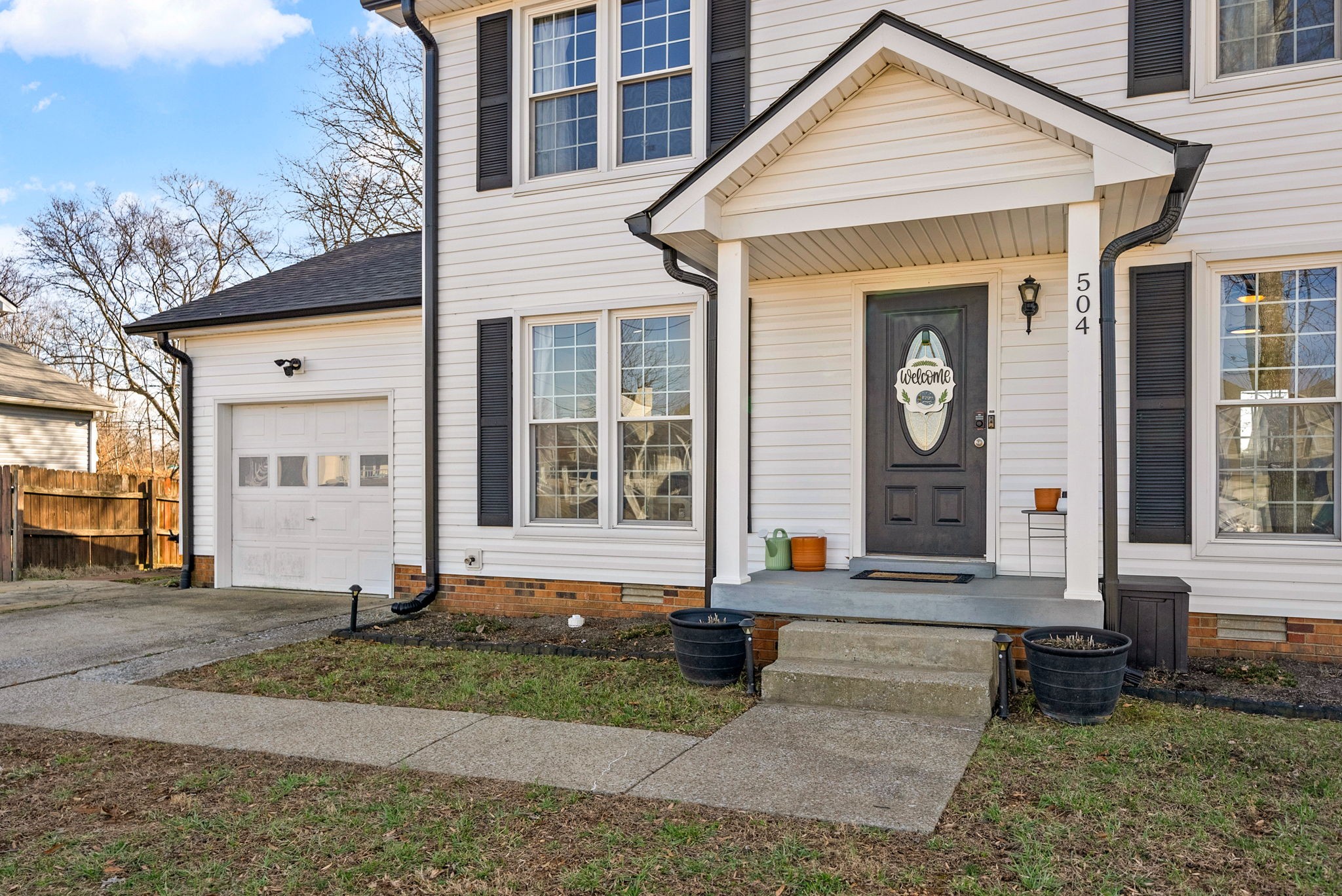 504 Eysian Road Clarksville, TN 37040 - Photo 4 of 41 a front view of a house with a yard and garage