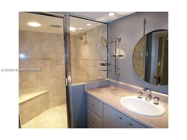 a bathroom with a sink double vanity and a mirror