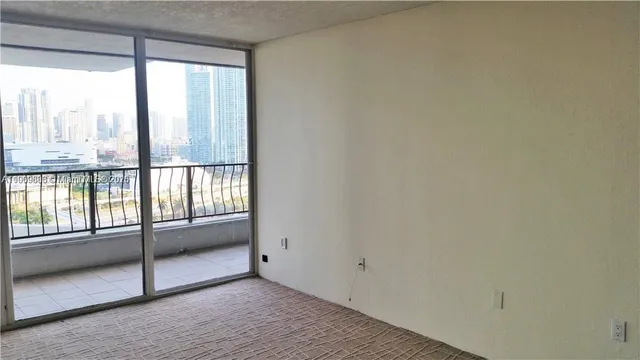 a view of an empty room and window