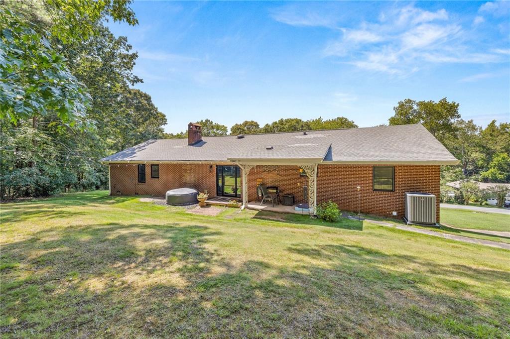 6470 Samoa Way Flowery Branch, GA 30542 - Photo 54 of 61 a view of a house with a yard