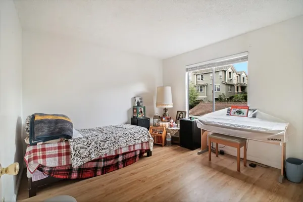 a bedroom with bed and a window