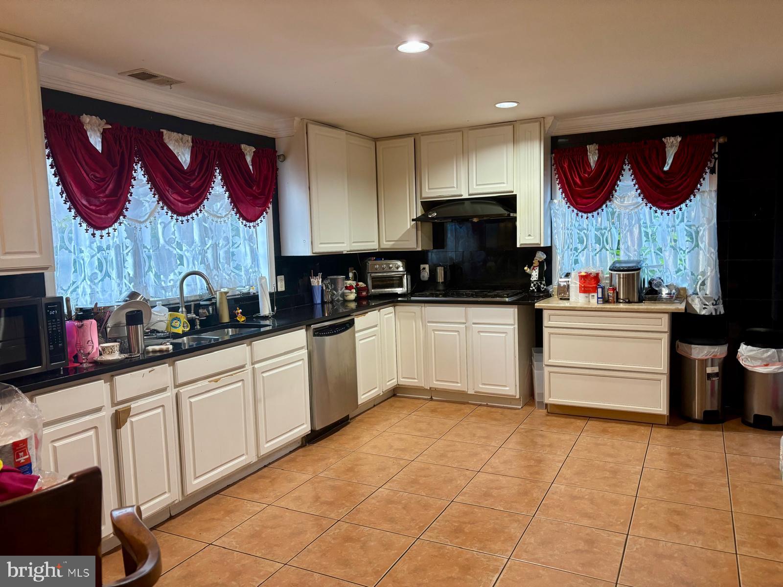 3610 64th Avenue Landover, MD 20785 - Photo 6 of 20 a kitchen with stainless steel appliances granite countertop a sink and cabinets