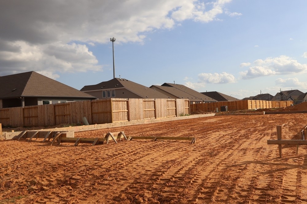 2834 Gdn Mdw Street Fulshear, TX 77423 - Photo 10 of 17 a front view of a house with a yard
