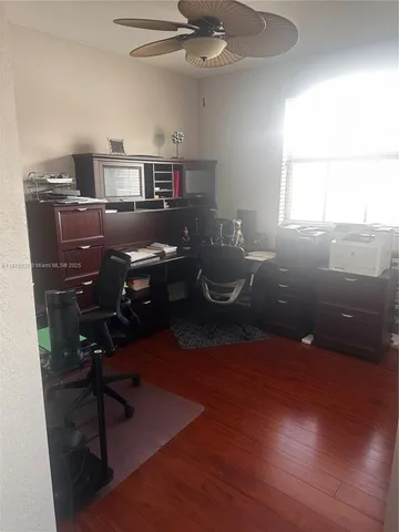 a workspace with furniture and wooden floor