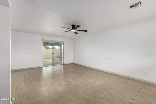 a kitchen with granite countertop a stove sink and cabinets