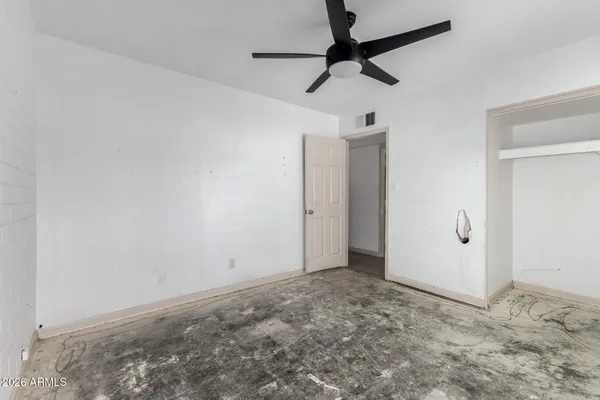 a white bath tub sitting next to a shower