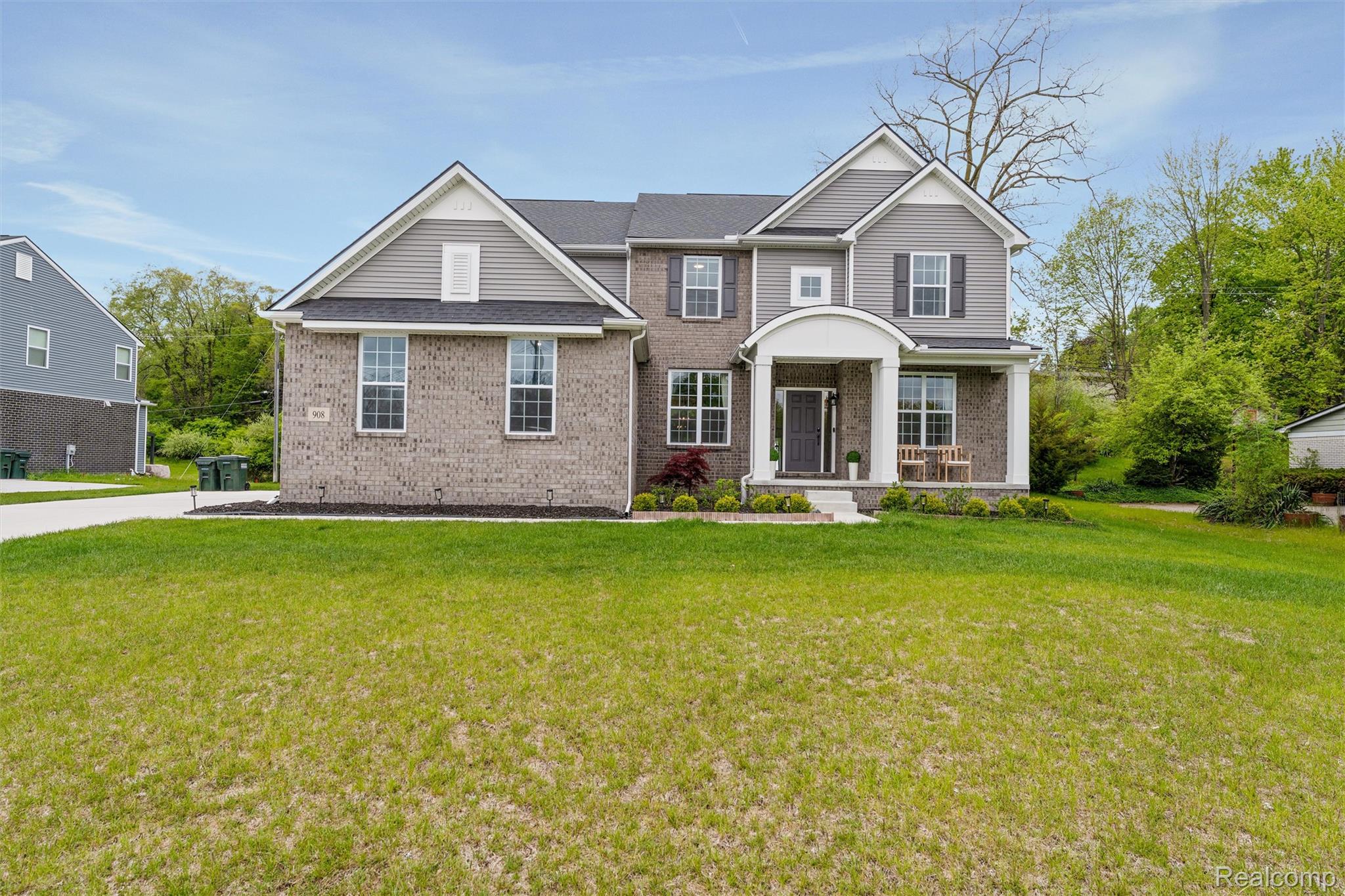 908 South Livernois Road Rochester, MI 48309 - Photo 1 of 49 Traditional-style home featuring brick siding and a front lawn