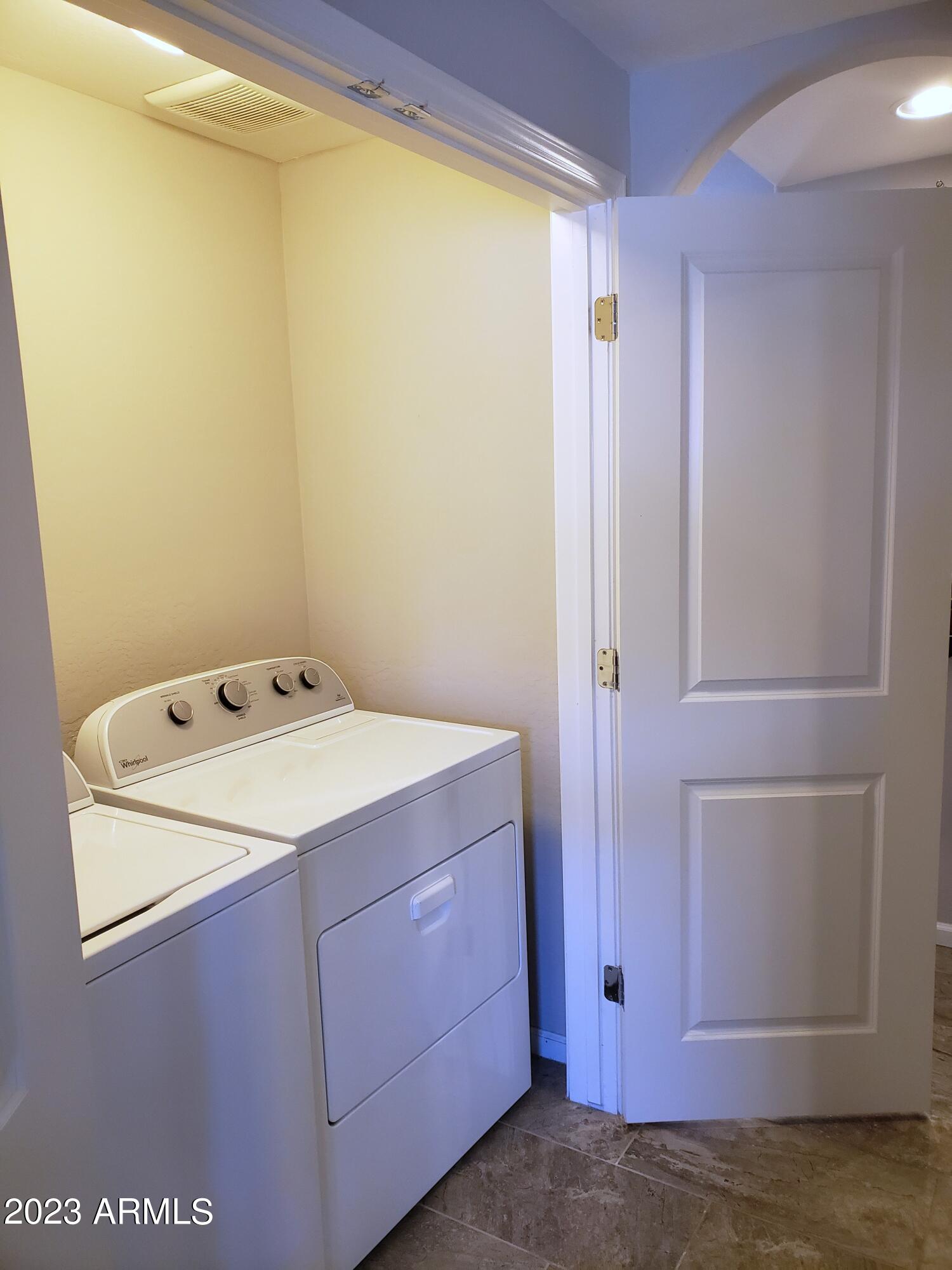 3935 East Rough Rider Road, Unit 1307 Phoenix, AZ 85050 - Photo 11 of 34 a utility room with dryer and washer