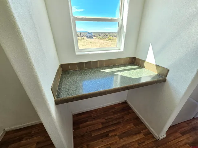 a view of kitchen and wooden floor