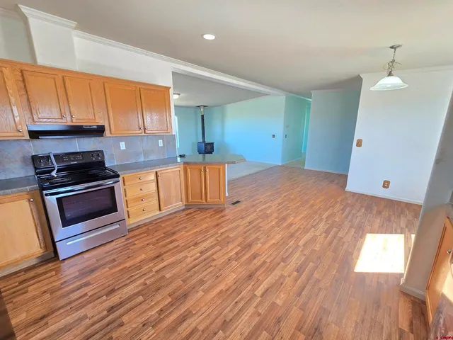 a kitchen with stainless steel appliances a refrigerator sink and cabinets
