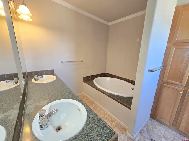 a bathroom with a sink and mirror