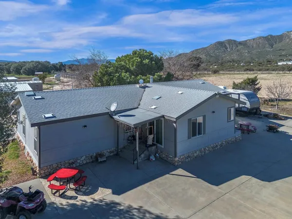 a view of a house with a snow on the road