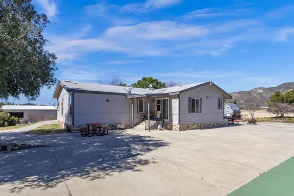 a house view with a backyard space