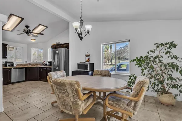 a bedroom with a bed and a television