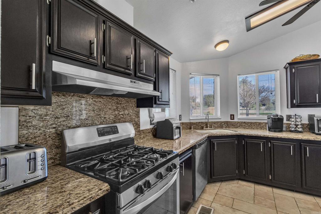 35683 Breezy Lane Ranchita, CA 92066 - Photo 42 of 73 a kitchen with stainless steel appliances granite countertop a stove sink and cabinets