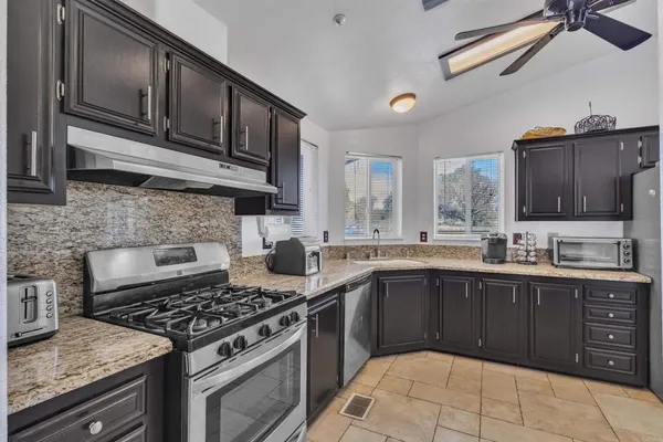 a bed room with a bed and a chandelier