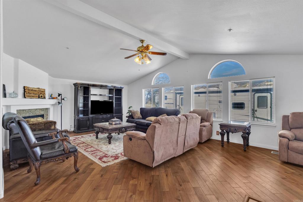 35683 Breezy Lane Ranchita, CA 92066 - Photo 46 of 73 a living room with furniture a fireplace and a flat screen tv