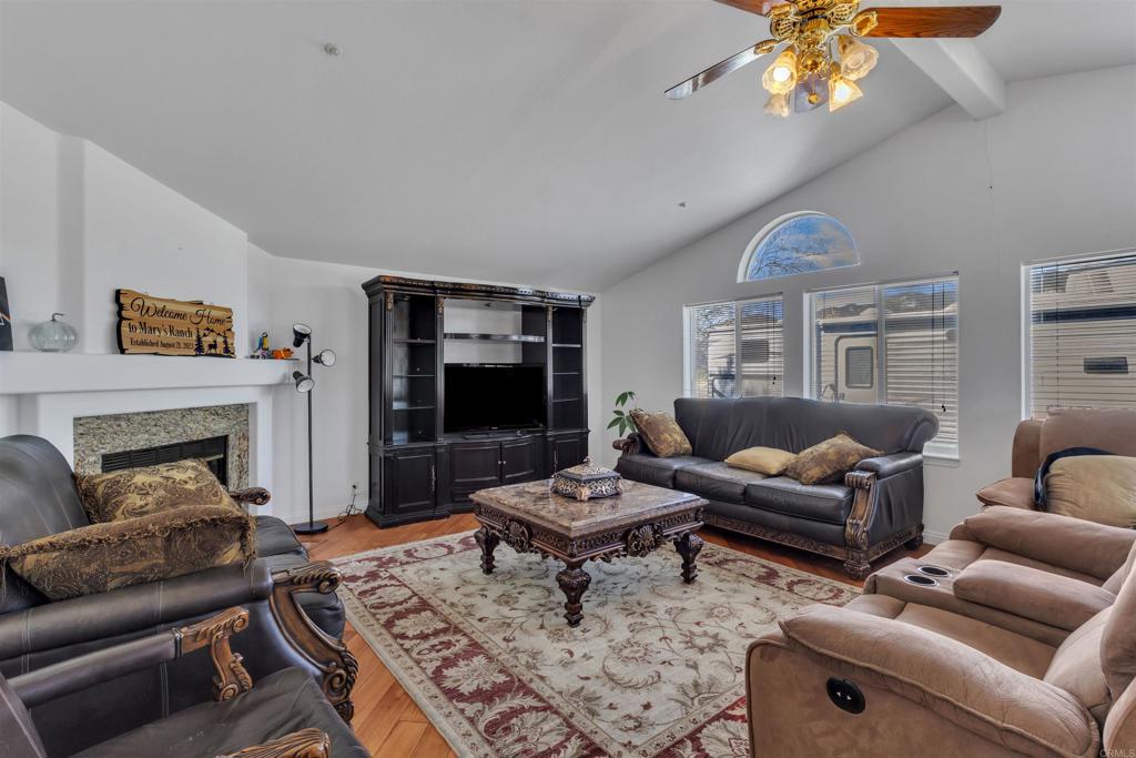 35683 Breezy Lane Ranchita, CA 92066 - Photo 47 of 73 a living room with furniture a fireplace and a chandelier