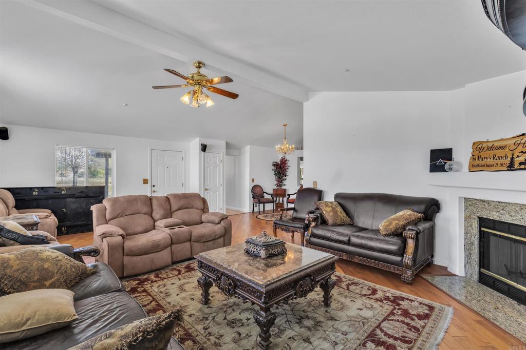 35683 Breezy Lane Ranchita, CA 92066 - Photo 51 of 73 a living room with furniture a rug and a fireplace