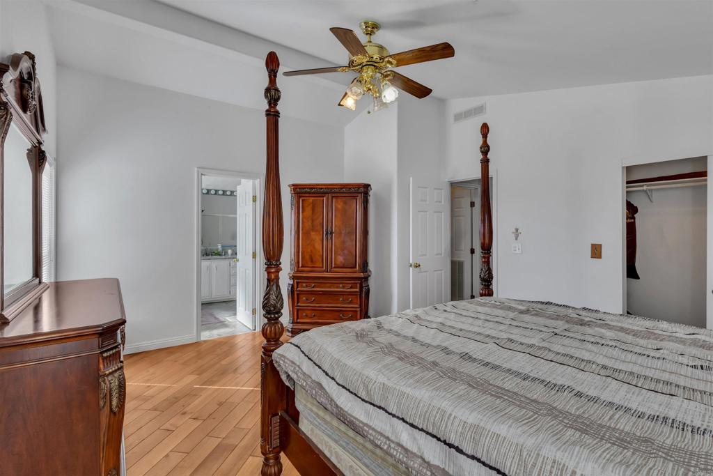 35683 Breezy Lane Ranchita, CA 92066 - Photo 62 of 73 a bedroom with a bed dresser and a chandelier