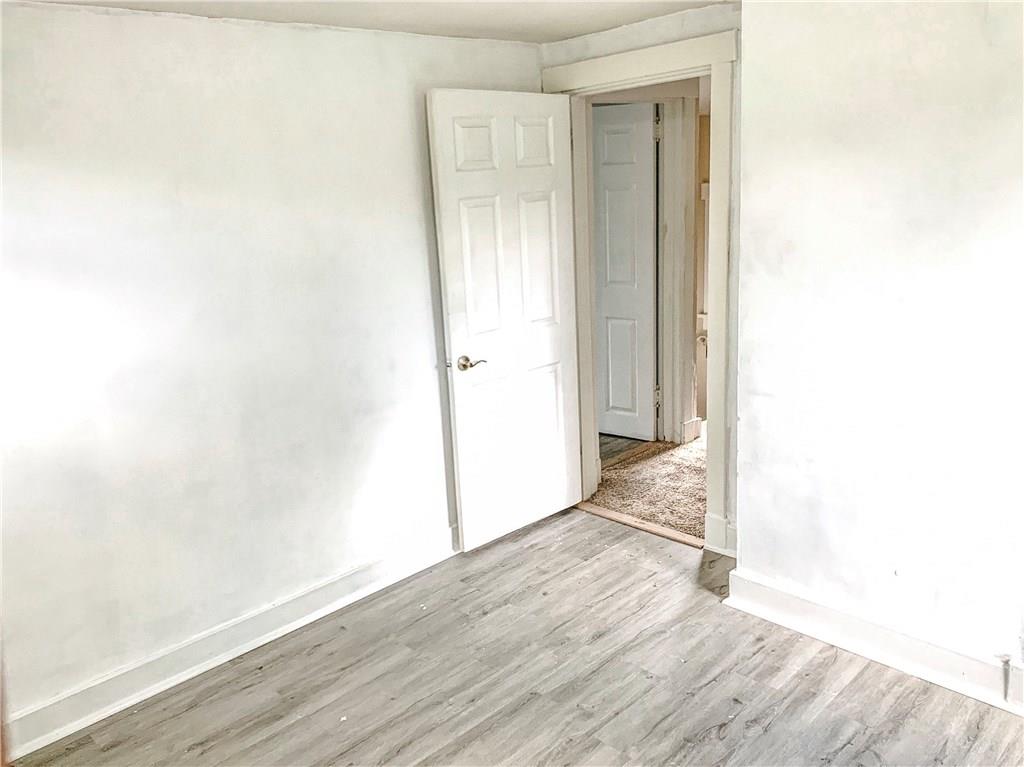 138 Universal Road Pittsburgh, PA 15235 - Photo 22 of 25 3rd bedroom! All new paint and vinyl flooring!