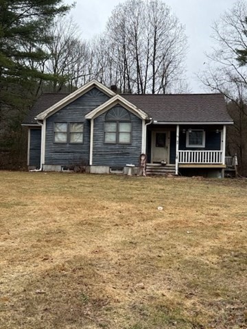 30 Stone Valley Road Orange, MA 01364 - Photo 2 of 6 a house with trees in the background