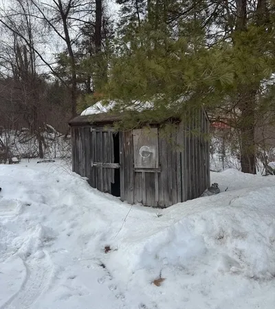 a view of a backyard of the house