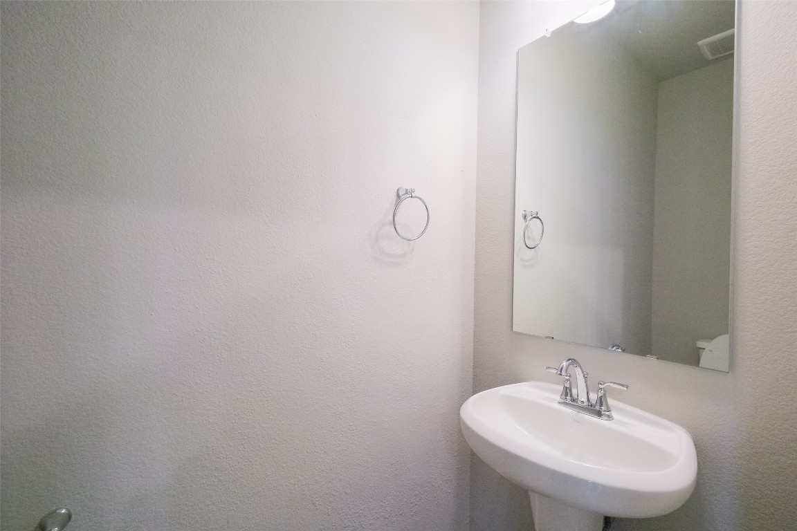 6434 New York Street Houston, TX 77021 - Photo 12 of 27 a bathroom with a sink and a mirror